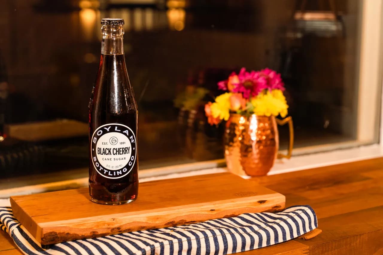 Boylan Black Cherry in a clear glass bottle.