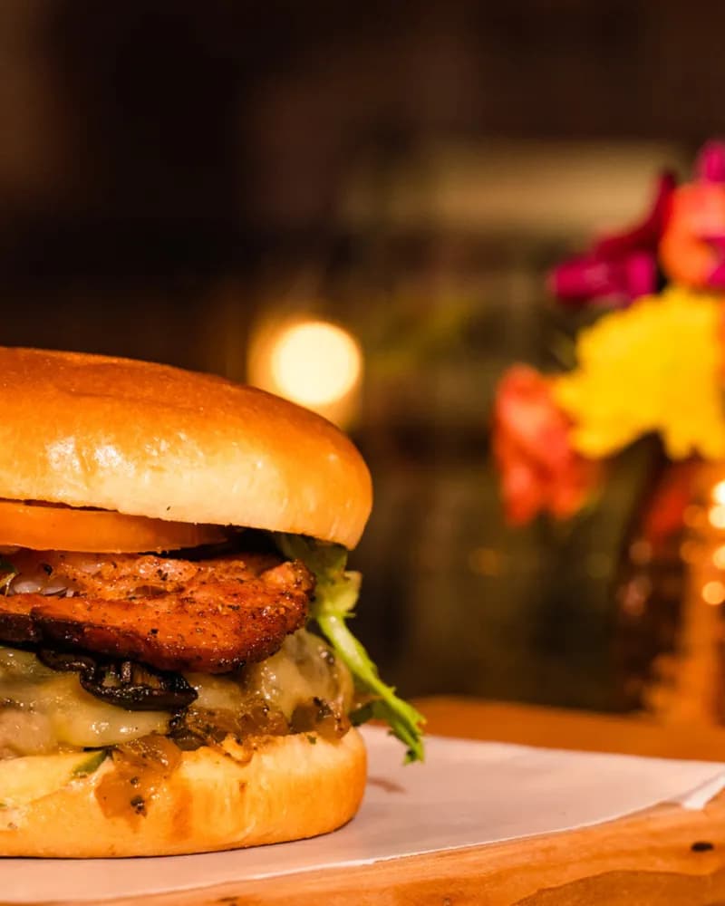 Wonderful — a cheeseburger from chef and co-owner Mark McLean, loaded with mushrooms, Havarti, house Canadian bacon, and spicy Bootstrap BBQ on a brioche bun.